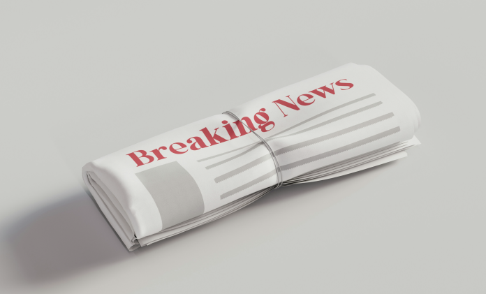Image: Rolled up newspaper with headline "breaking news" | Parenting During Difficult Times